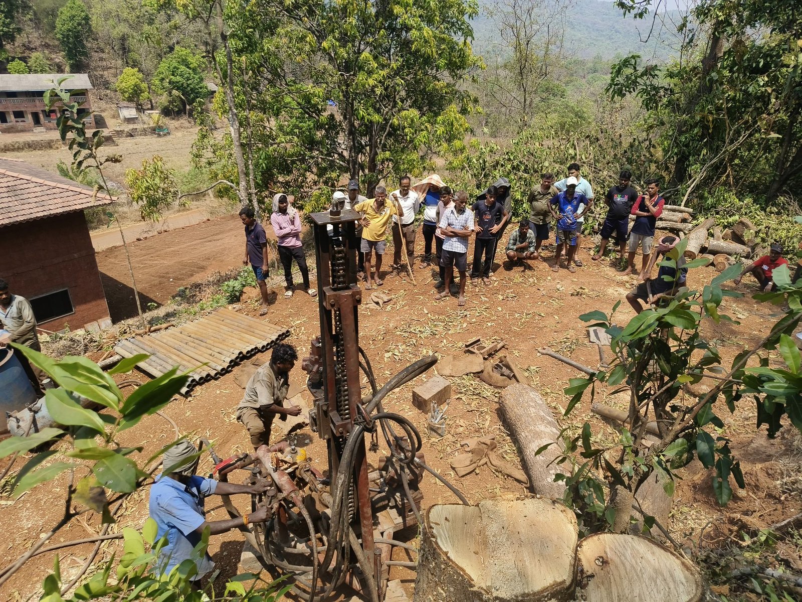 Community members gathered at a drinking-water work site in Shiravane, Dapoli