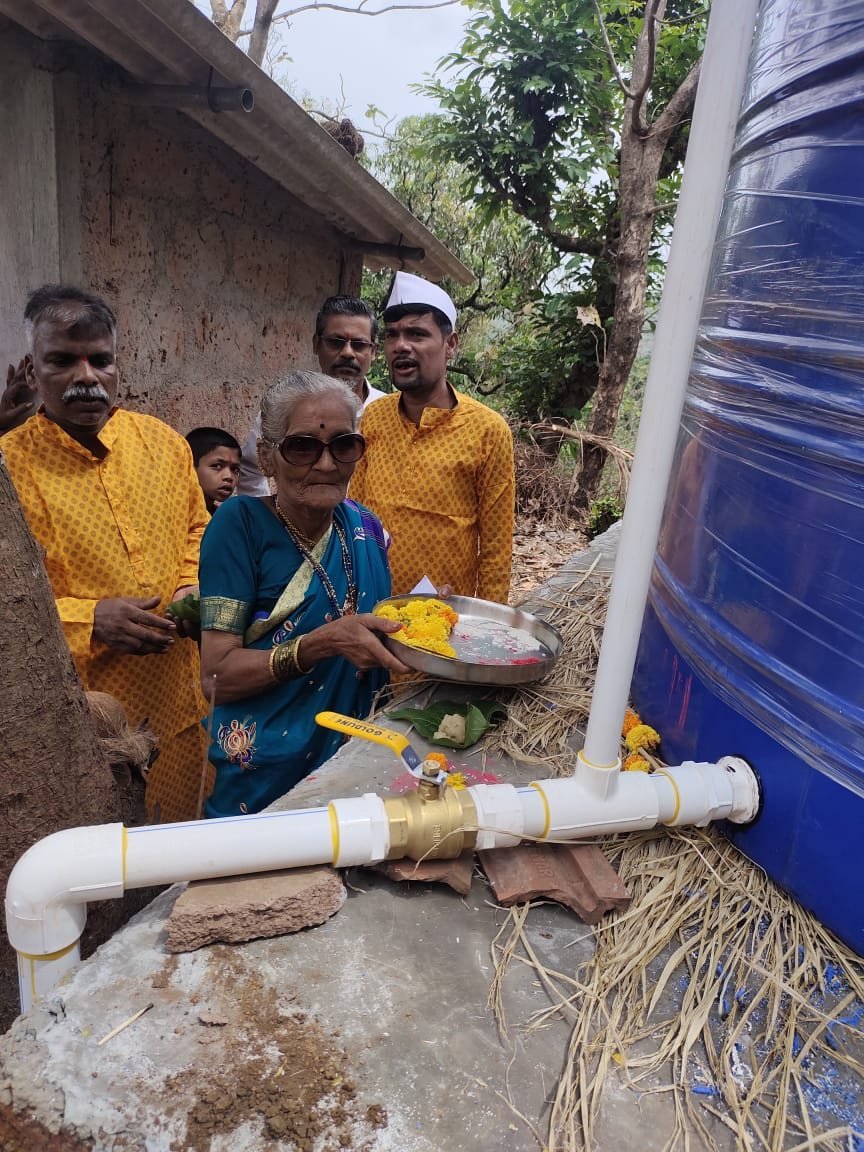 Community members at a drinking-water facility